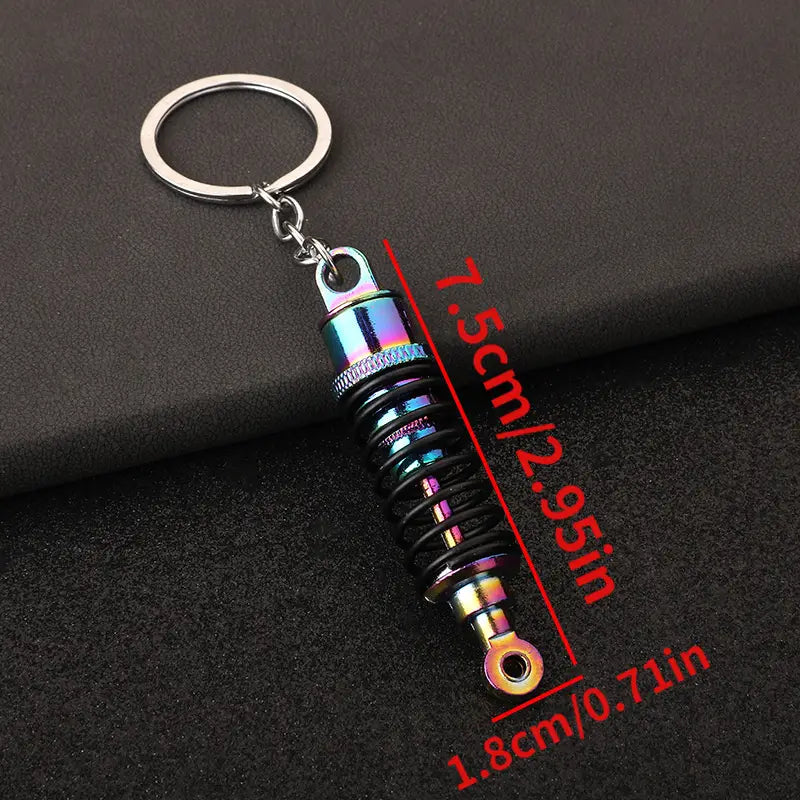 Car Shock Absorber Keychain ميدالية على شكل جامبينات مساعدات سيارة في علبة وتغليف